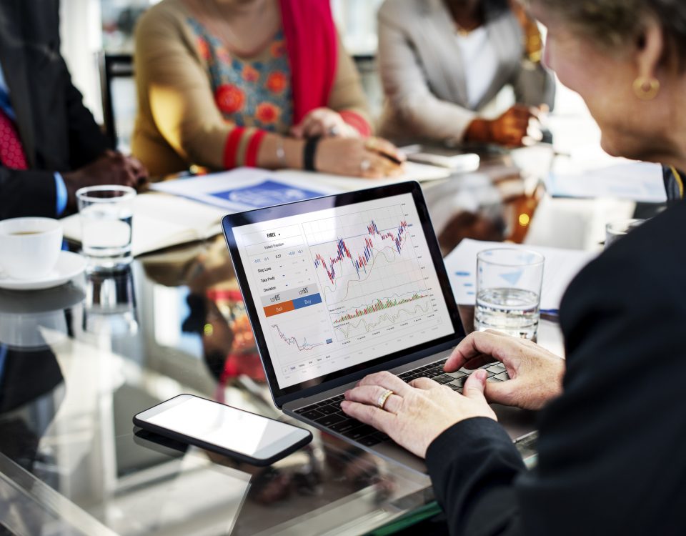 woman on computer doing forex